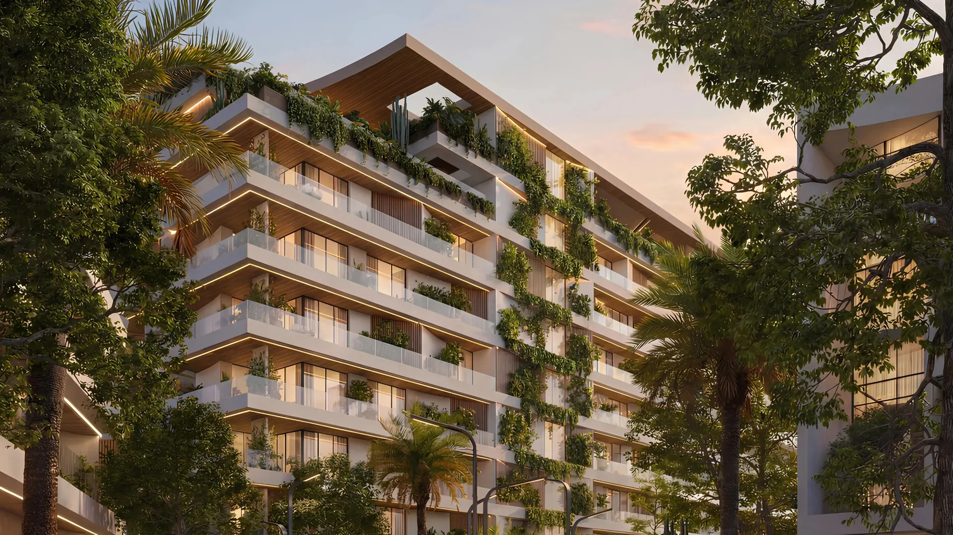 Reef at Lunaya Terraces – balkonai su augalais rožinio saulėlydžio fone
